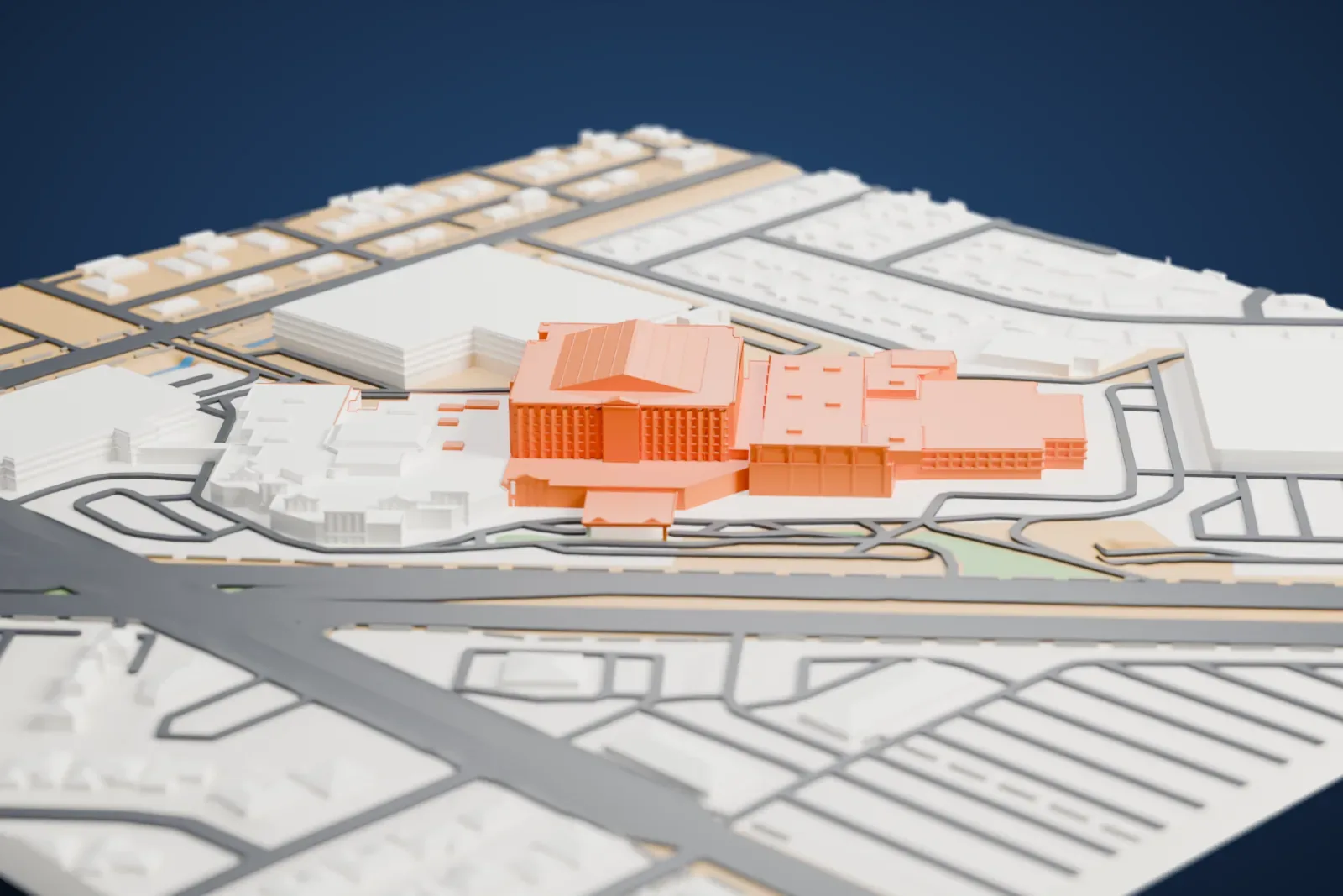A white 3D print of Sam's Town Hotel and Gambling Hall, a hotel tower with a pitched roof above low casino wings, surrounded by large buildings, roads and rows of small houses.