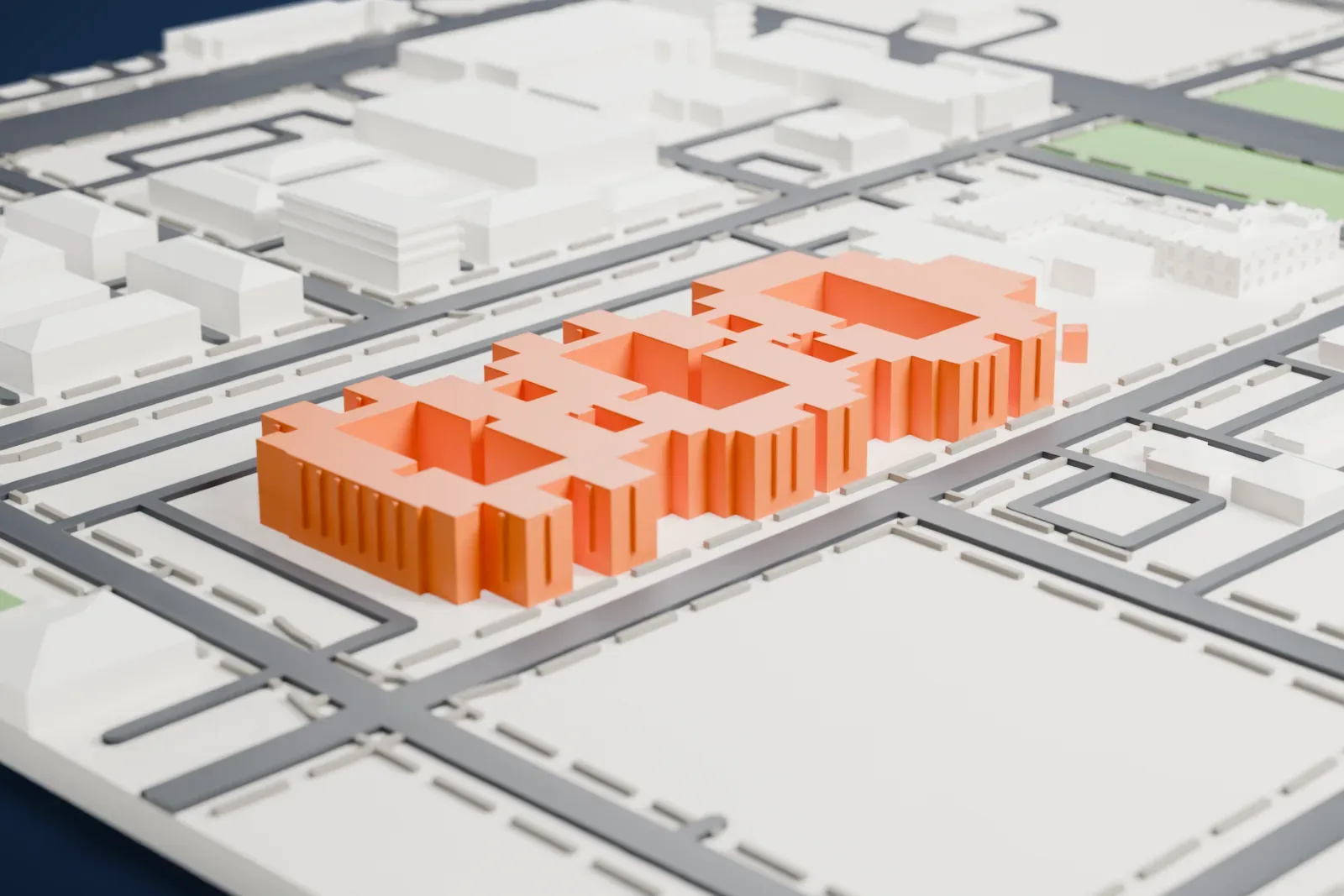 A white 3D print of the San Marcos Hotel, a low building of offset wings with notched parapets and a row of thin columns, set among streets, lots and nearby buildings.