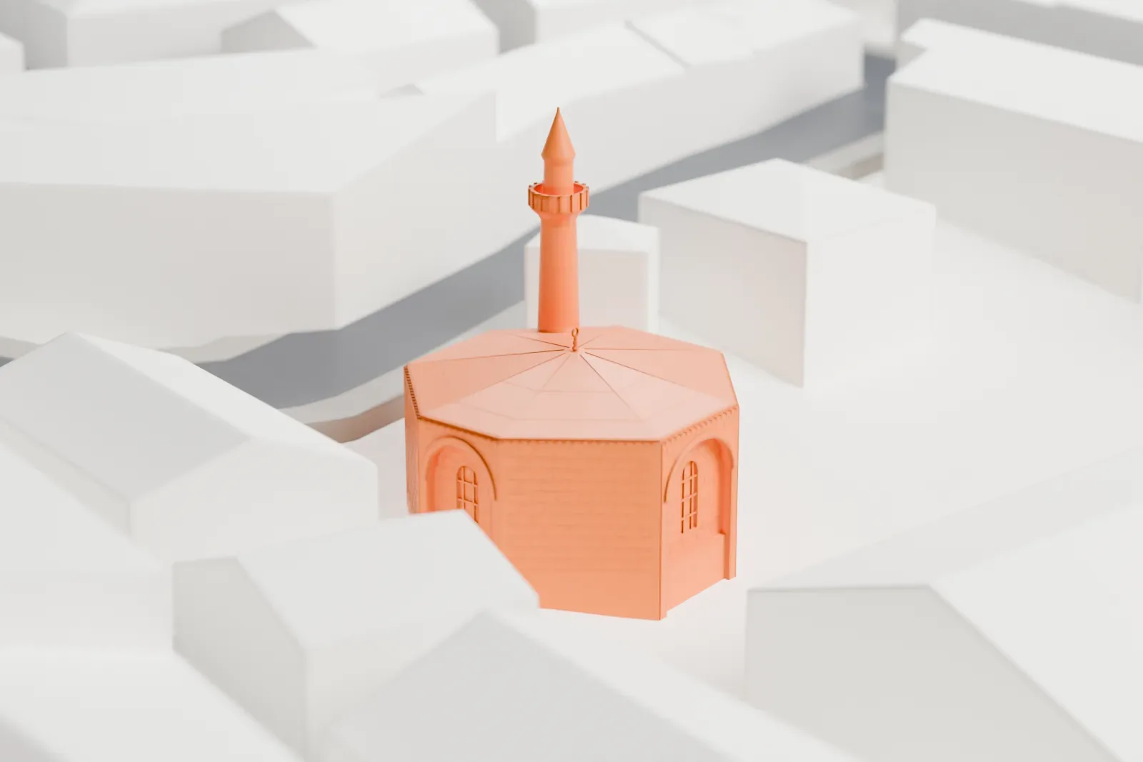 A white 3D print of the Sancaktar Hayrettin Mosque, a small building among surrounding streets and buildings.