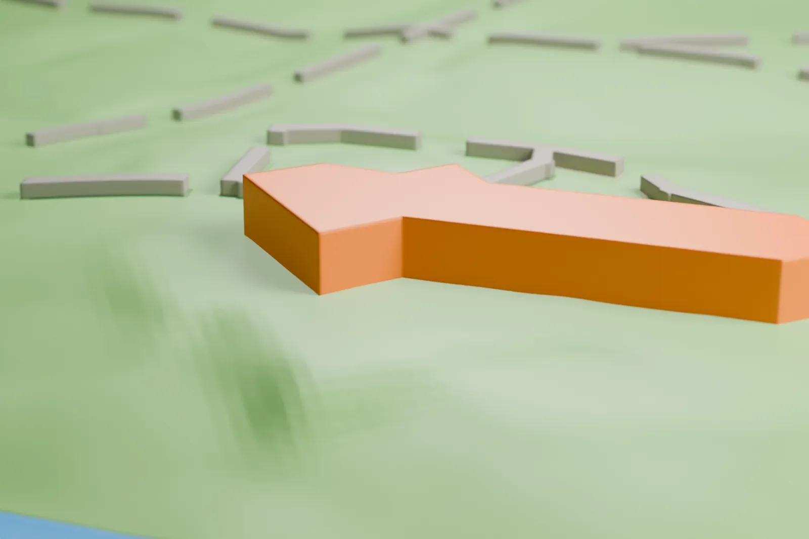 A white 3D print of the Sandra Day O'Connor House, a long, low house with wide angled roofs, on green hilly ground with a stream nearby.