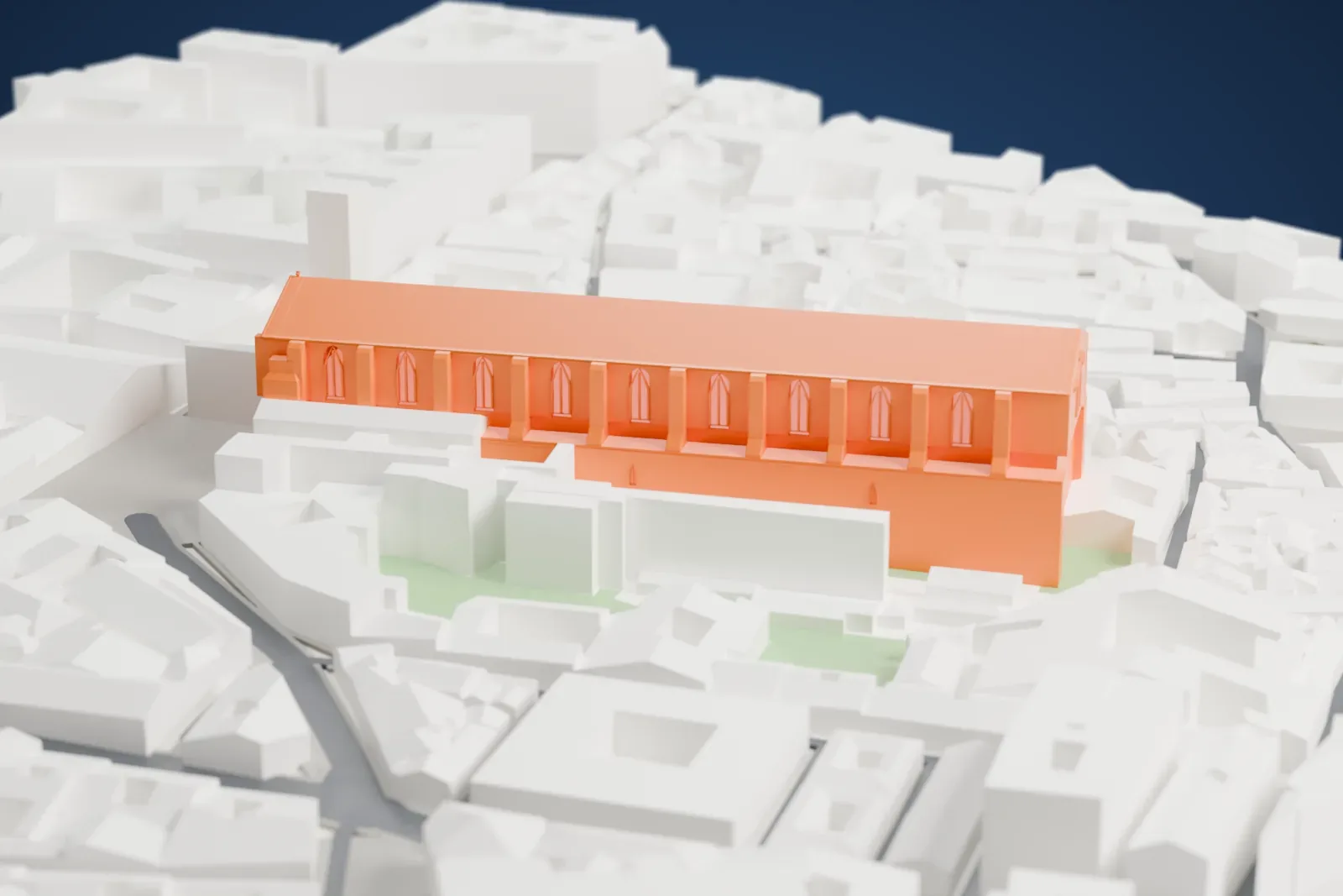 A white 3D print of Santa Chiara, a long rectangular church, among the surrounding streets and buildings of Naples.
