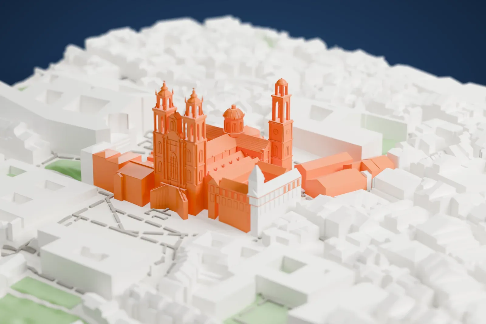 A white 3D print of Santiago de Compostela Cathedral, a large church with two tall towers at the west front, a domed crossing and a rounded east end, among dense city buildings.