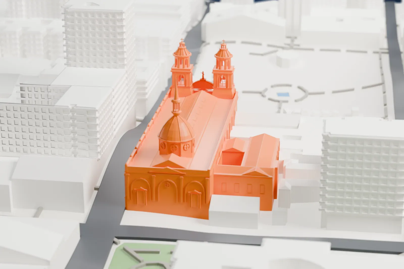 A white 3D print of Santiago Metropolitan Cathedral, a long church with a domed crossing and two cupola-topped towers on its front, surrounded by city blocks and a landscaped plaza.