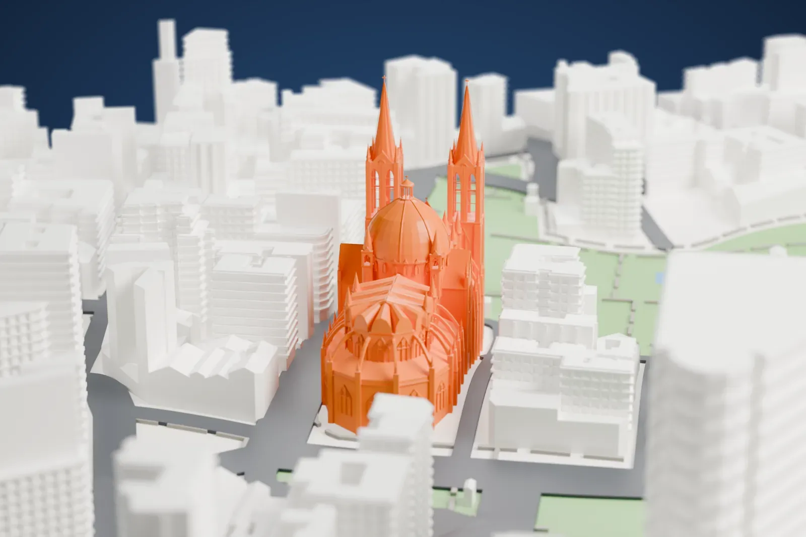 A white 3D print of the São Paulo Cathedral, a church with two tall spires, many small pinnacles and a large dome, standing among dense buildings beside a park.