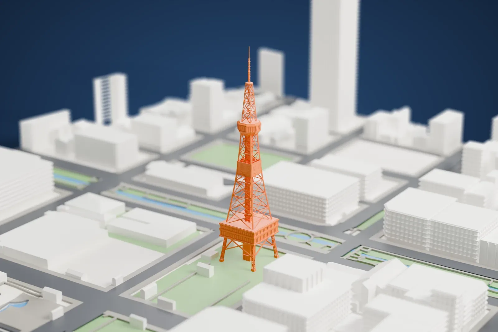 A white 3D print of the Sapporo TV Tower, an open lattice tower with clocks and a faceted observation cabin, standing in Odori Park among streets and buildings.