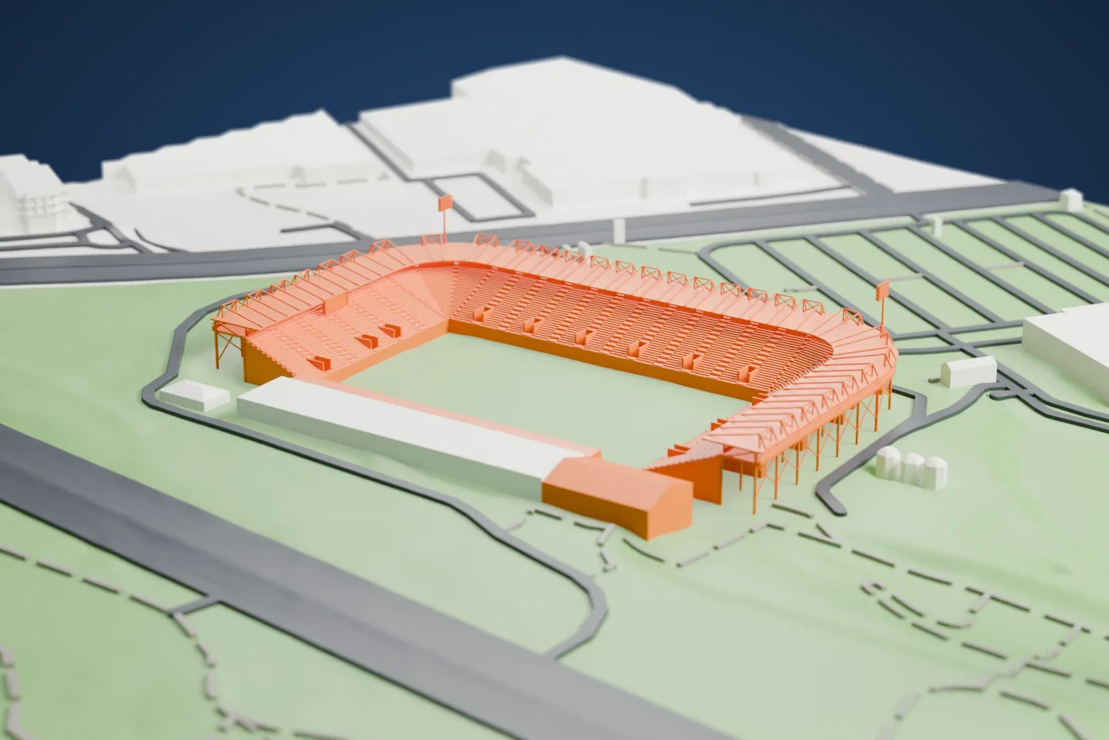 A white 3D print of Saputo Stadium, a horseshoe of open stands on slim stilts with floodlight masts, beside a long building, with parking lots, grass and roads around it.