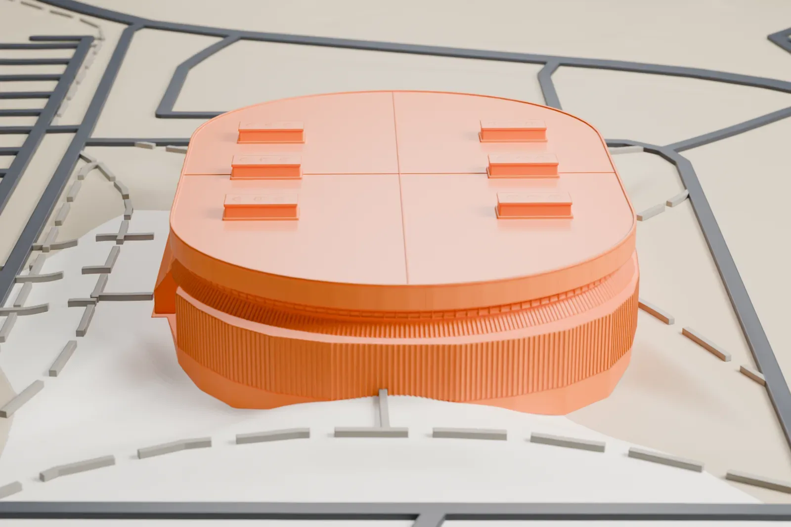 A white 3D print of SaskTel Centre, a low oval arena with a flat roof, small rooftop boxes and a sloped entrance canopy, surrounded by roads and open ground.