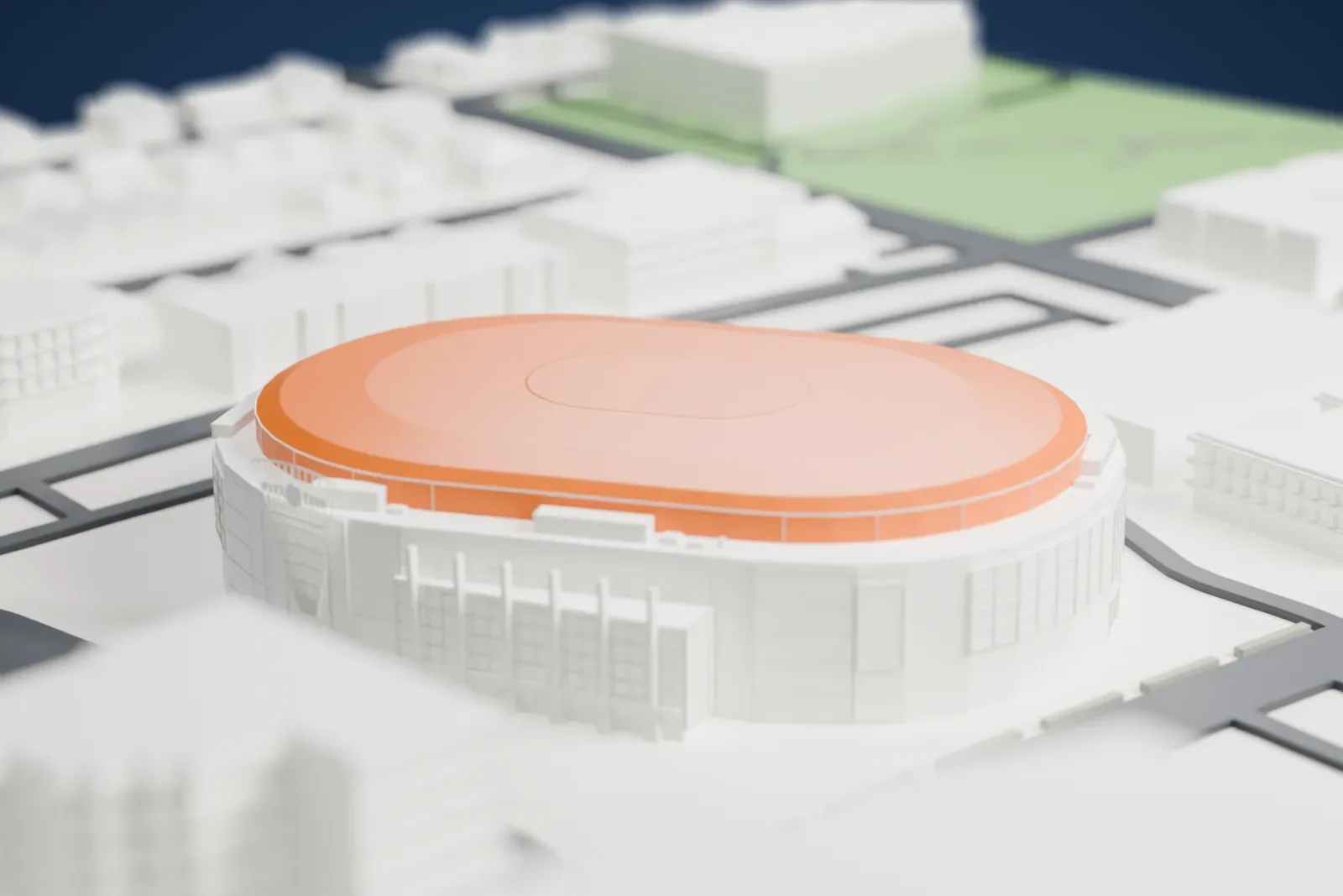 A white 3D print of Save-On-Foods Memorial Centre, a rounded oval arena with a low domed roof and a glass-fronted entrance, among low buildings and streets.