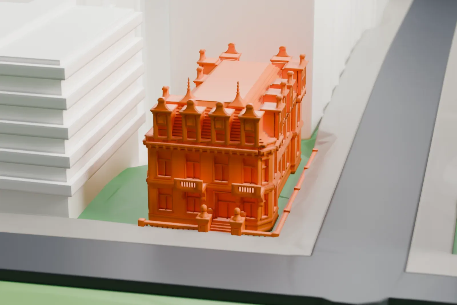 A white 3D print of the Schinasi House, a freestanding mansion, among the surrounding streets and buildings.