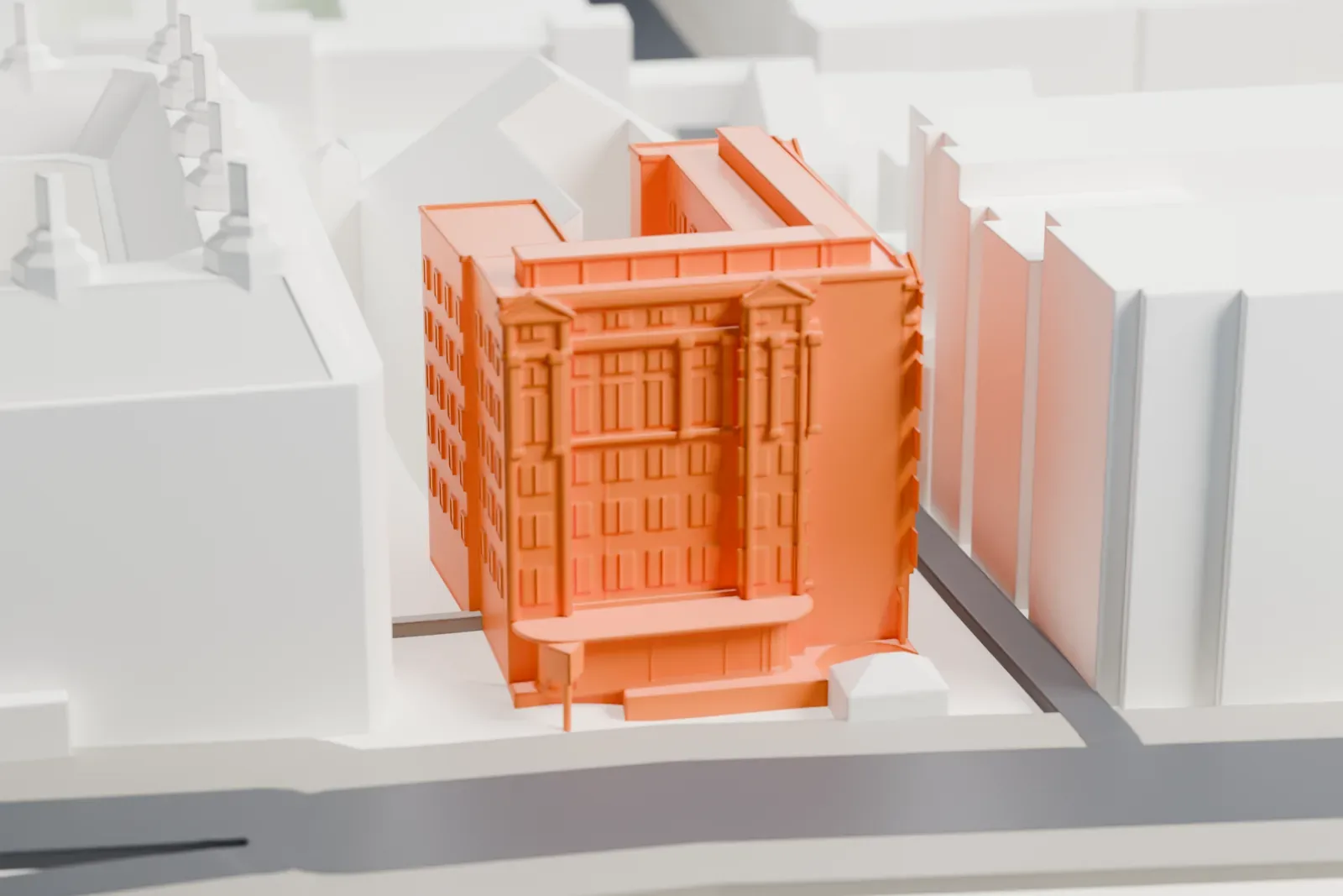 A white 3D print of Scotland Yard, its facade set among the surrounding streets and buildings of central London.
