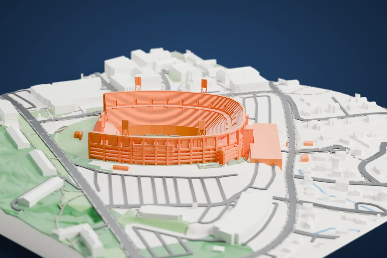 A white 3D print of Scott Stadium, a large oval bowl of many seating rows with thin light towers around it, ringed by roads and small buildings.