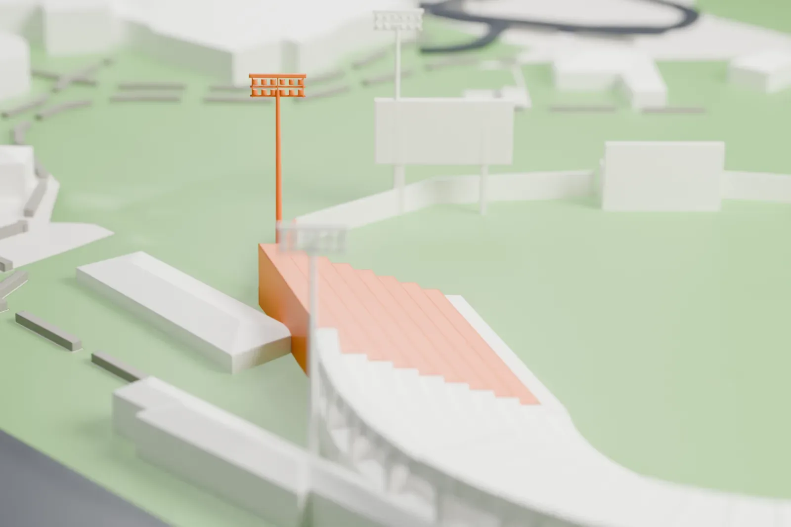 A white 3D print of Scottsdale Stadium, a curved grandstand of stepped tiers around a green field with slim light towers, among nearby buildings and roads.