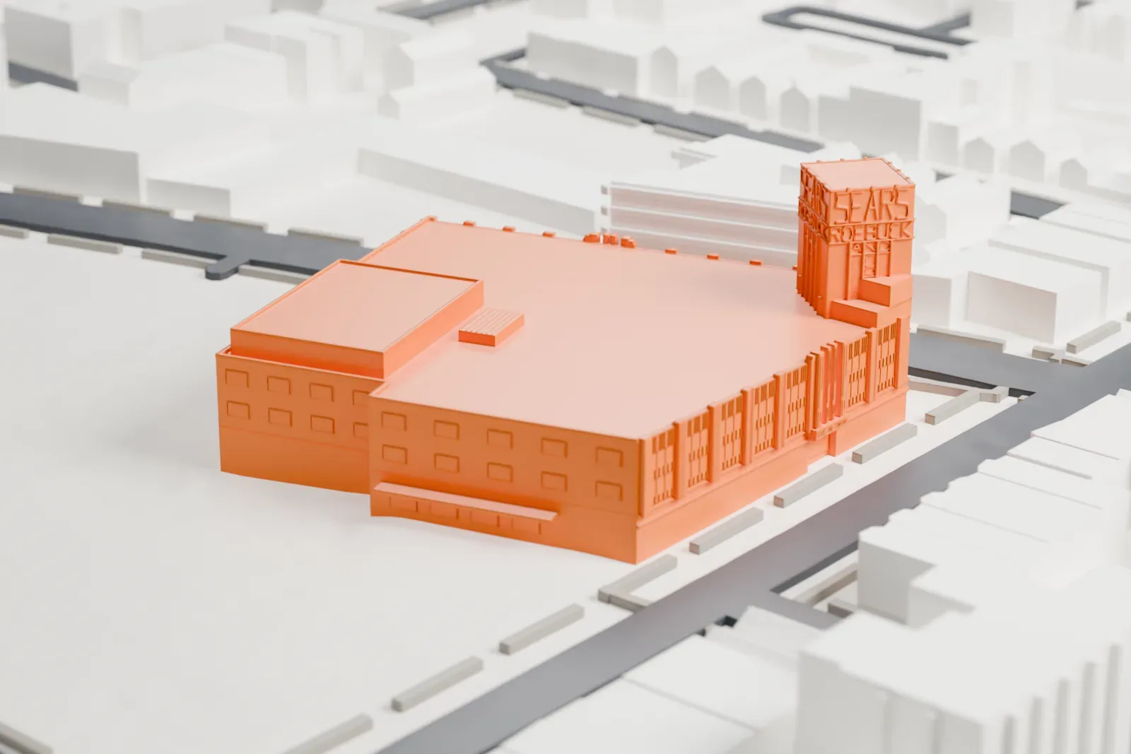 A white 3D print of the Sears Roebuck & Company Department Store, an L-shaped building with a lettered corner tower, beside streets and low buildings with open ground around it.