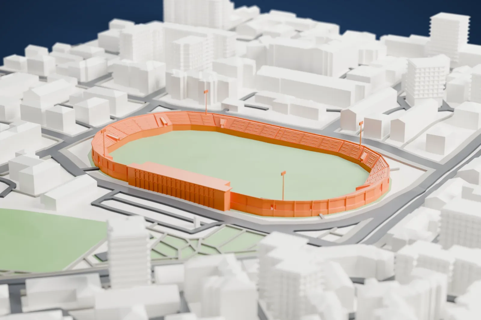 A white 3D print of the Selman Stërmasi Stadium, a low oval of open terraces with a short canopy over the west stand, among the streets and buildings of Tirana.