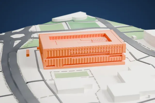 A white 3D print of the Shanghai Museum East model in Shanghai, with the streets around it.