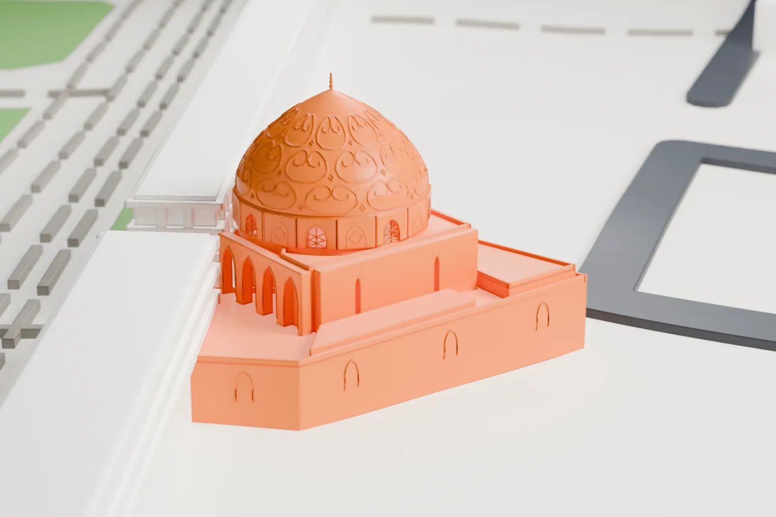 A white 3D print of the Sheikh Lotfollah Mosque model with its patterned dome, beside an open square, a rectangular pool, and surrounding buildings.