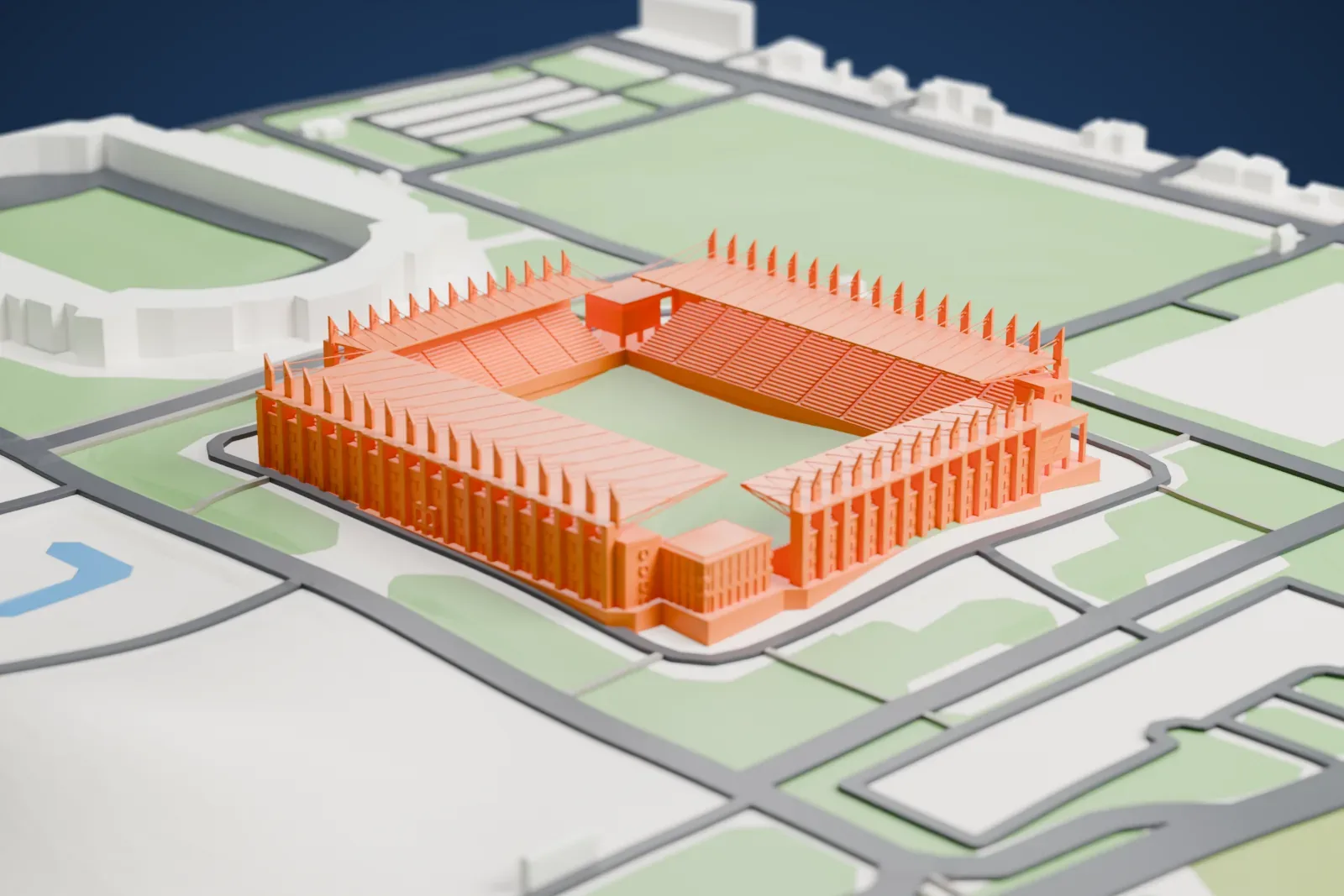 A white 3D print of Sheriff Arena, a rectangular football ground with four separate roofs and rows of pointed pylons, among the surrounding city.