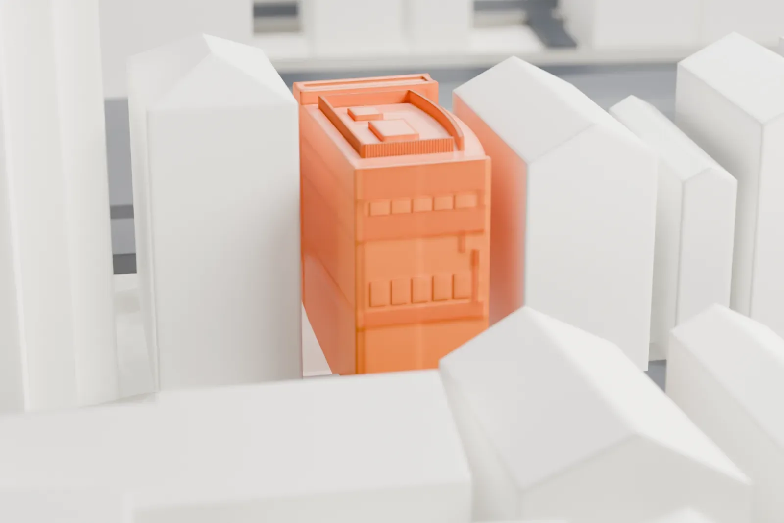 A white 3D print of Shin-Ōkubo Station on its elevated platform, with the surrounding city buildings.
