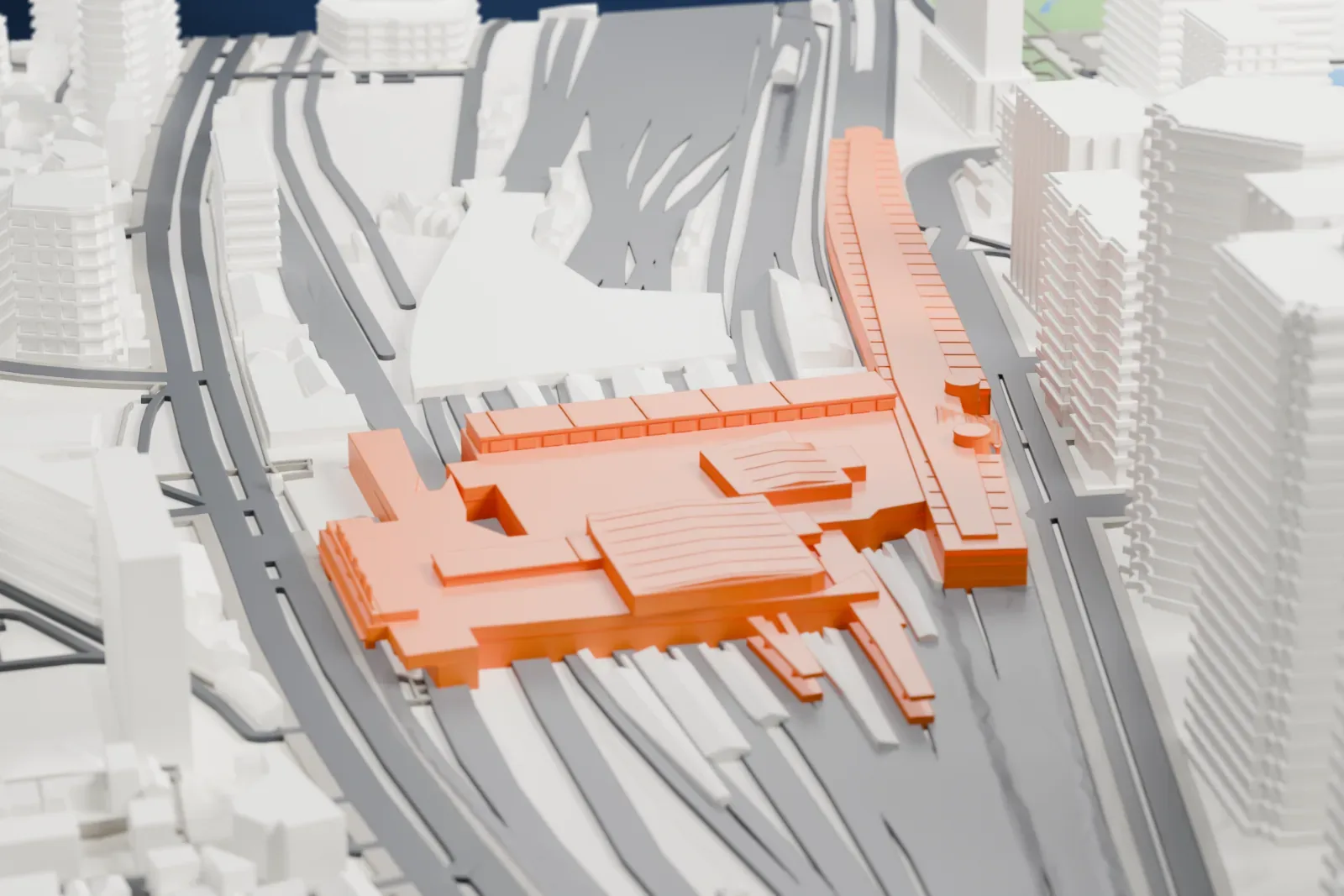 A white 3D print of Shinagawa Station, with the surrounding streets and buildings of Tokyo around it.