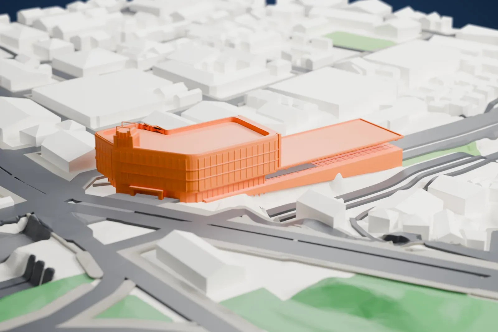 A white 3D print of Shinanomachi Station, with the surrounding streets and buildings.