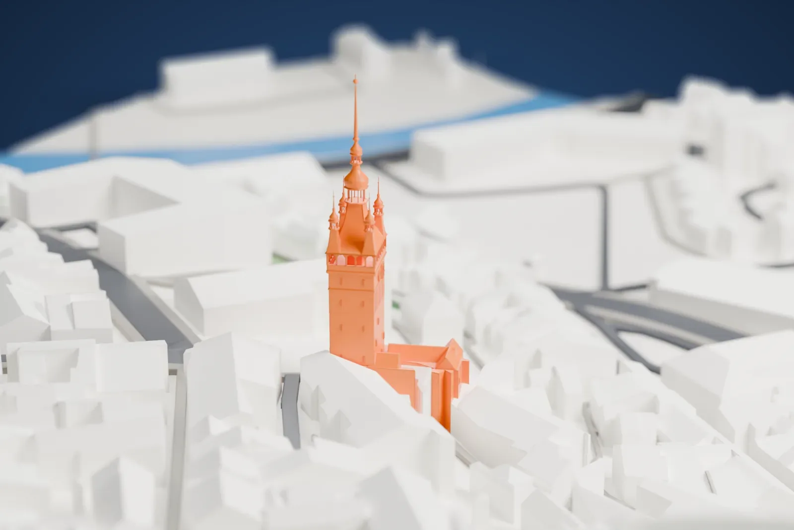 A white 3D print of the Sighișoara Clock Tower, a tall square tower with a steep roof, four corner turrets and a thin spire, among dense surrounding streets and buildings.