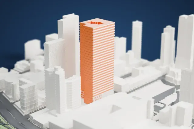 A white 3D print of the Silver Towers I model in New York, with the streets around it.
