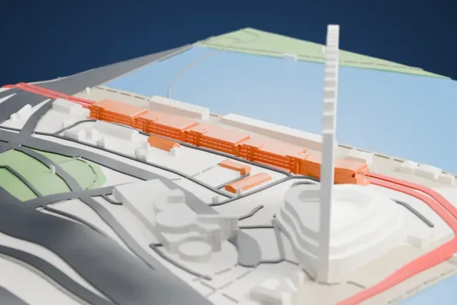 A white 3D print of the Singapore F1 Pit Building model in Singapore, with the streets around it.
