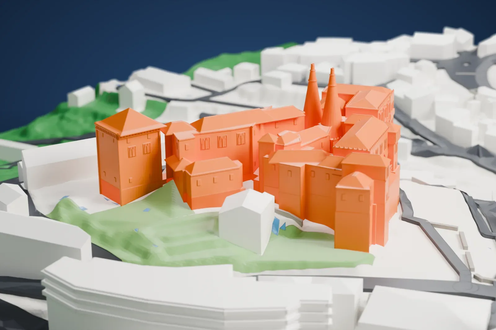 A white 3D print of the Sintra National Palace, a cluster of wings with pitched roofs, two tall conical chimneys and a square tower, surrounded by closely packed town buildings on sloping ground.