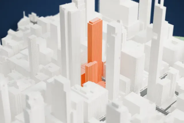 A white 3D print of the Sky House model in New York, with the streets around it.