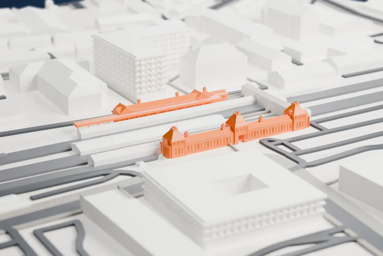 A white 3D print of Slough railway station with the surrounding streets and buildings.