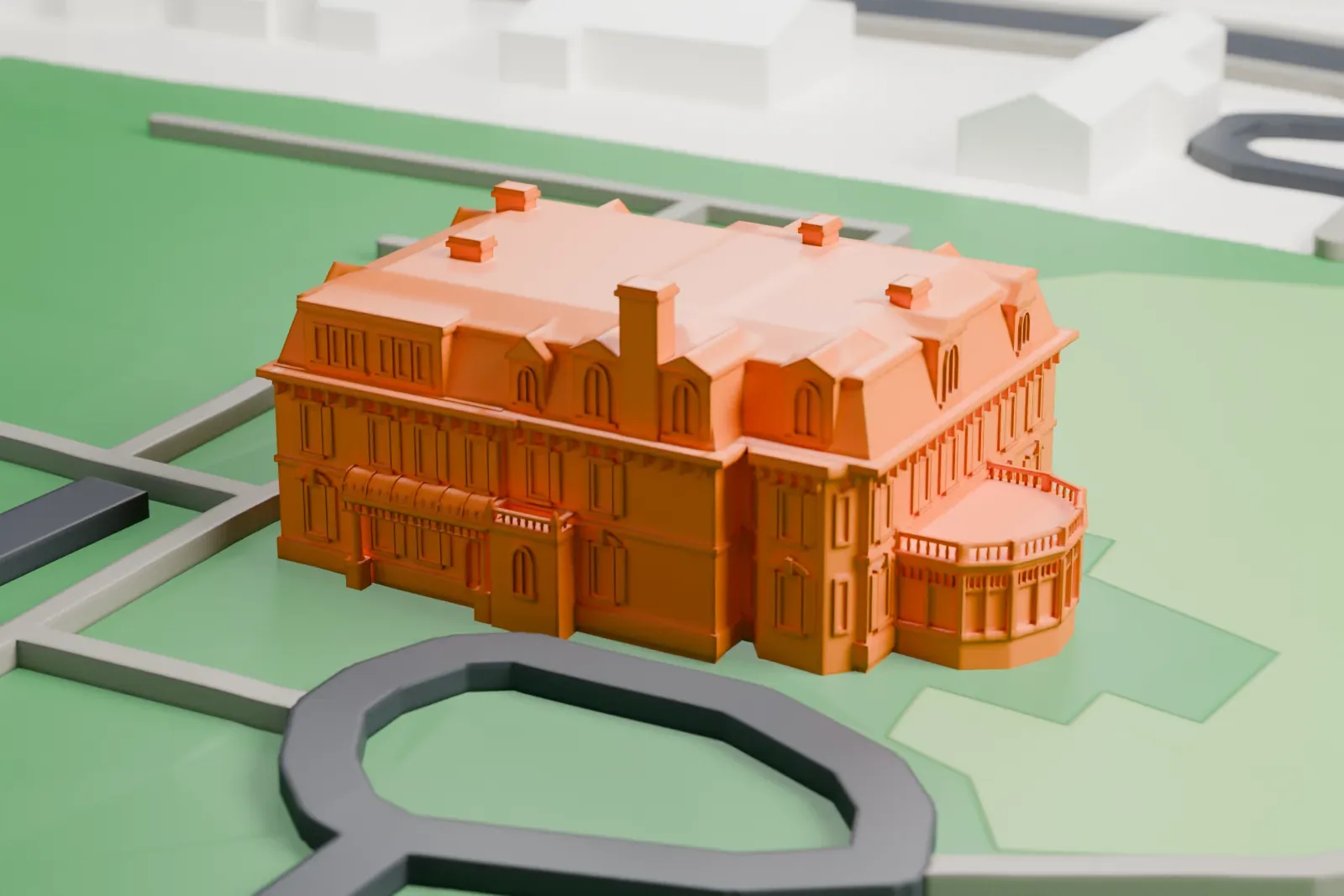 A white 3D print of Spadina House among the surrounding streets and buildings.