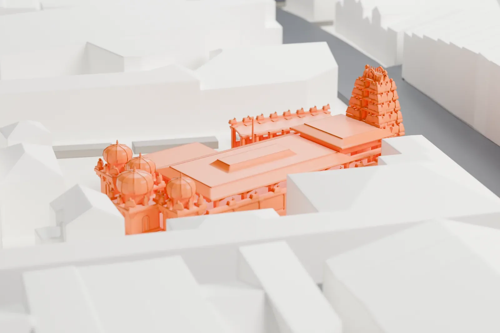 A white 3D print of Sri Mariamman Temple, a temple compound with a tiered entrance tower and small domed shrines, packed in among gray city buildings.