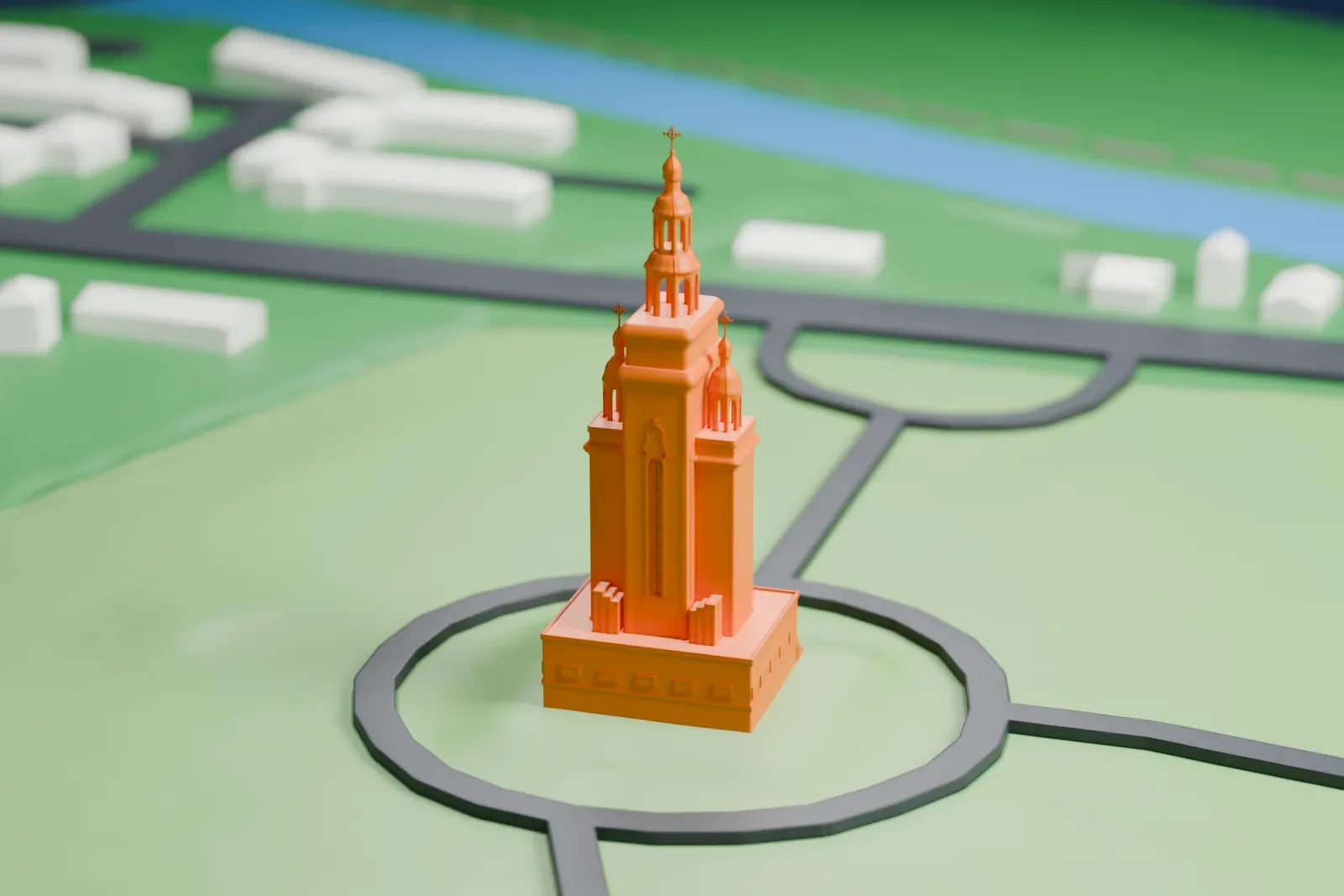 A white 3D print of St. Andrew Memorial Church, a tiered building with stacked cupolas topped by crosses, standing on a lawn inside a circular road.