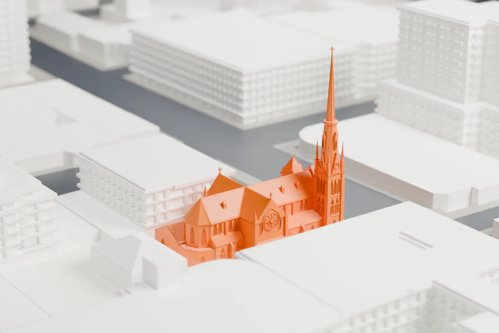A white 3D print of St. Andrew's Cathedral among the surrounding streets and buildings of Victoria.