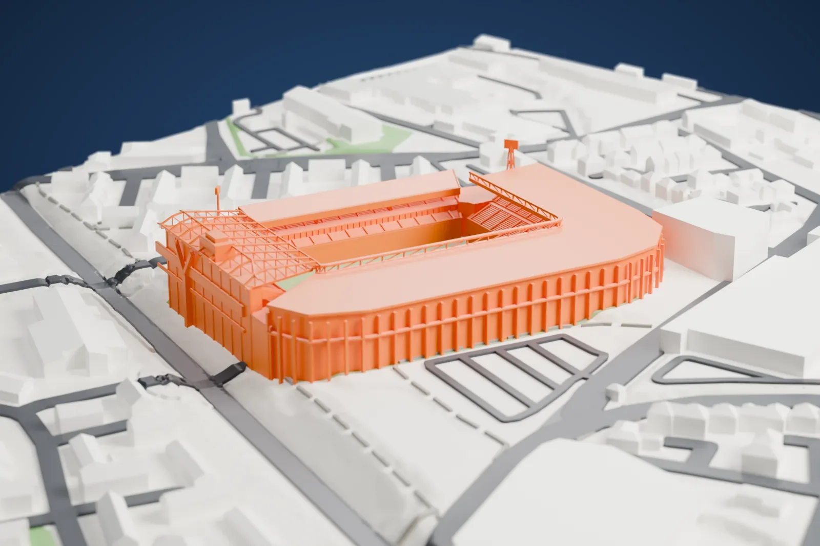 A white 3D print of St Andrew's, with the long L of the Kop and Tilton Road stands wrapping a rounded corner, a lower main stand opposite and floodlights at the open north corners, among the streets and buildings around it.