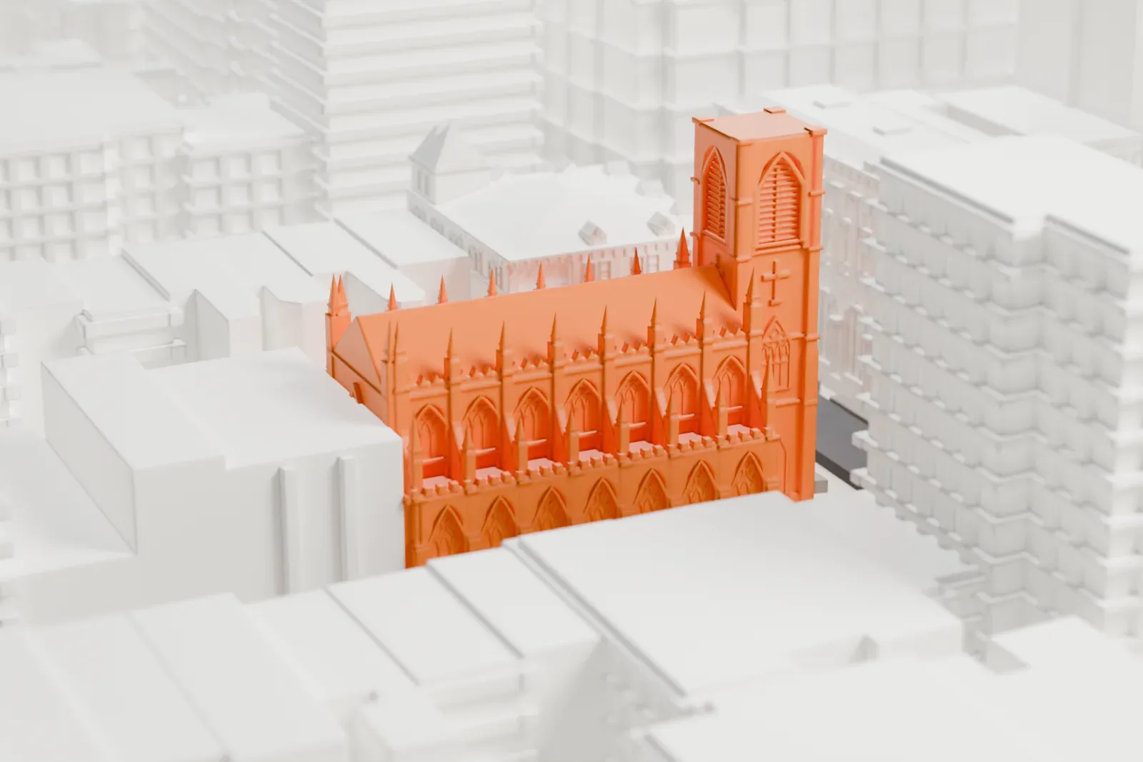 A white 3D print of St. Ann & the Holy Trinity Church, a long Gothic-style church with a square tower and many slim pinnacles, surrounded by taller buildings.