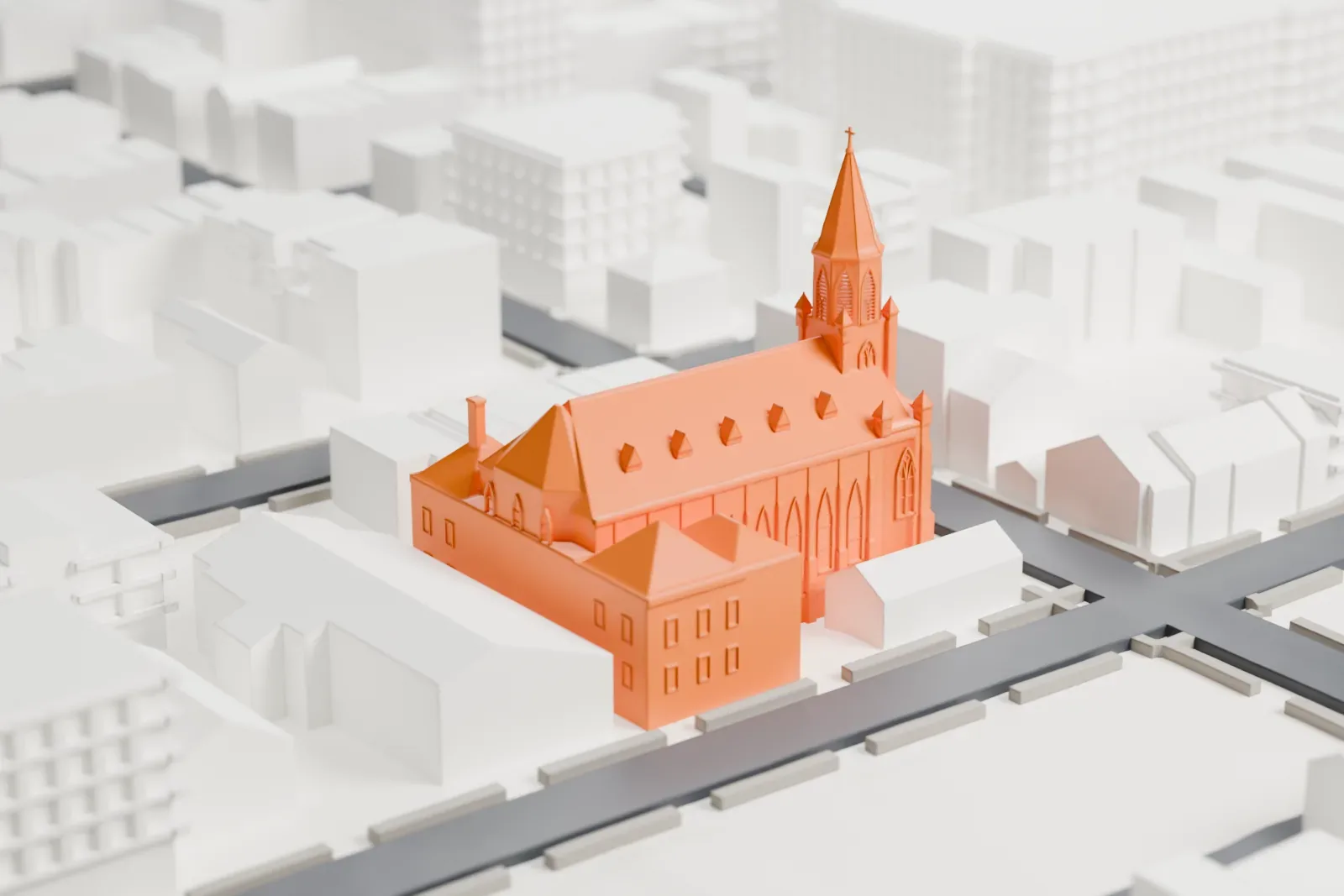 A white 3D print of St. Anthony of Padua Catholic Church, a church with a tall pointed spire and a steep roof, among low houses and city streets.