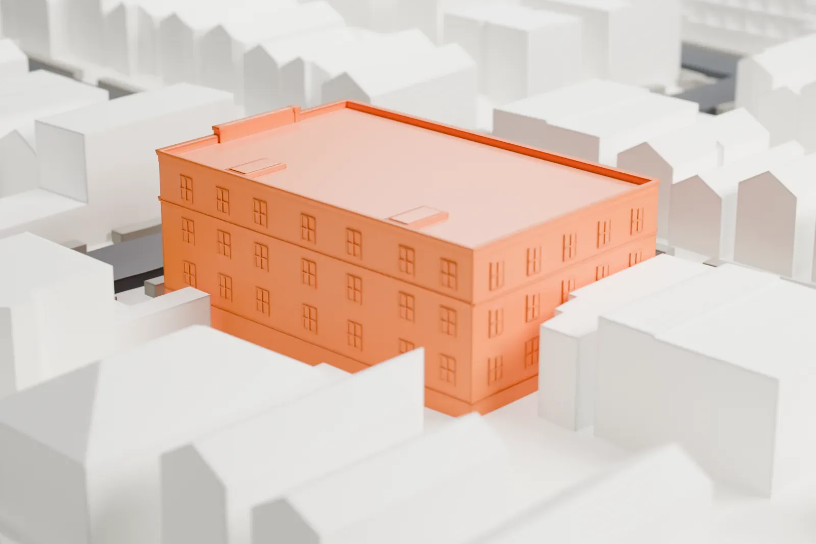 A white 3D print of St. Anthony's Church, a rectangular building with arched windows and a round window on its front, among small pitched-roof houses and streets.