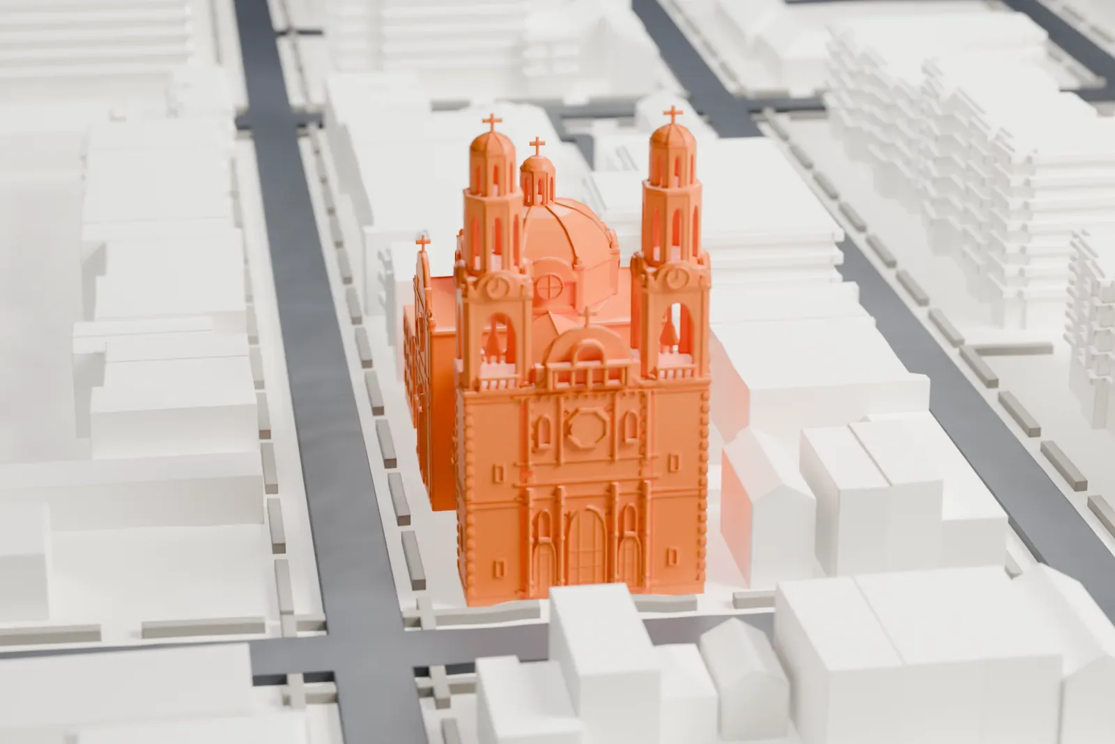 A white 3D print of St. Barbara’s Church, a domed church with two bell towers on its front, standing among low city blocks and streets.