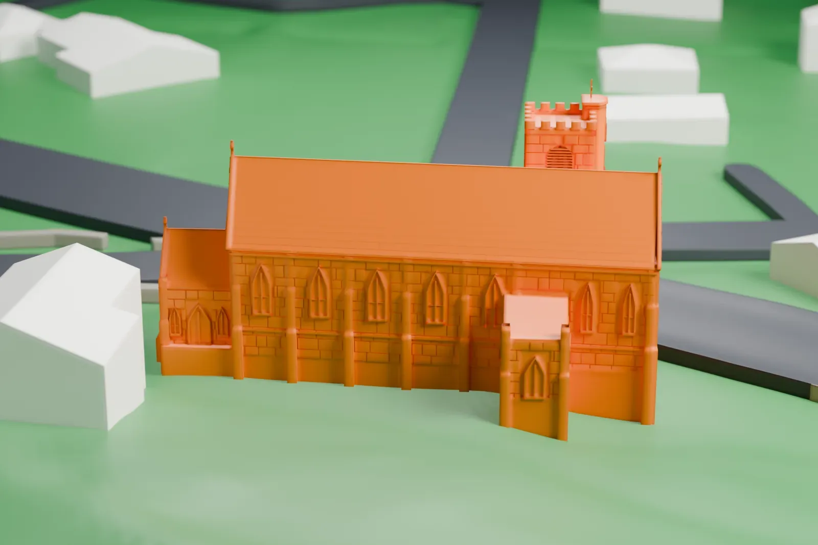A white 3D print of St. Bernard's Church and Parish House, a long gabled church with a battlemented square tower, on a grassy slope with a few houses and roads nearby.