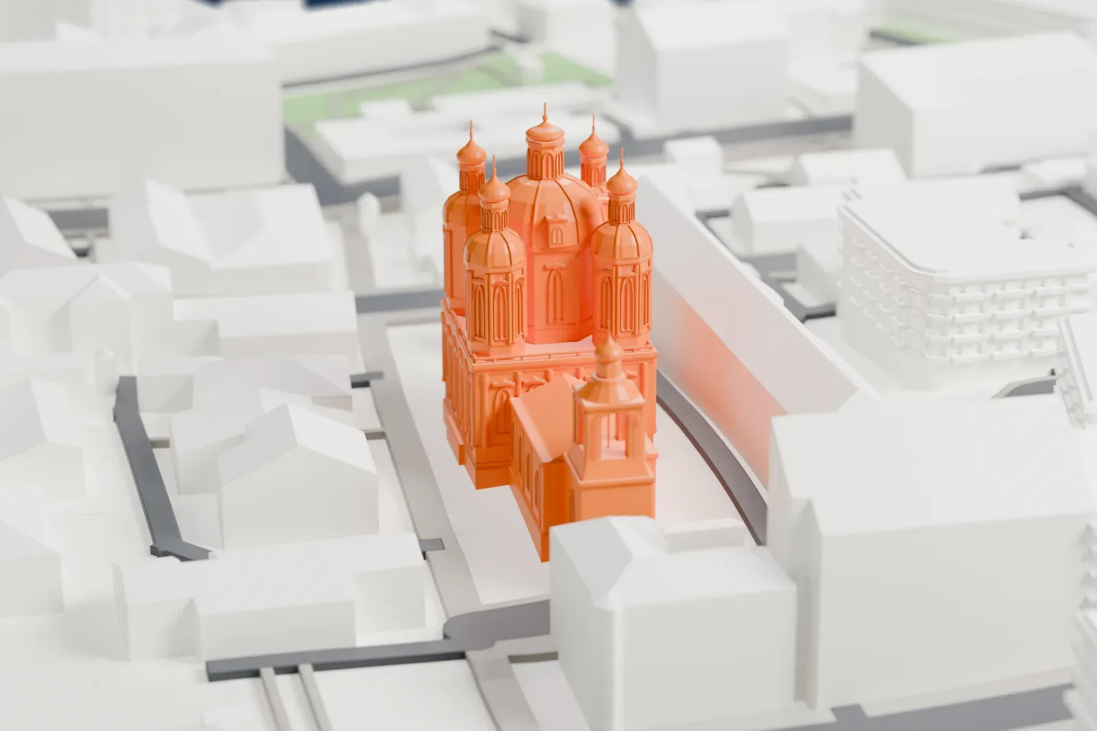 A white 3D print of St Clement's Church in Moscow among the surrounding streets and buildings.