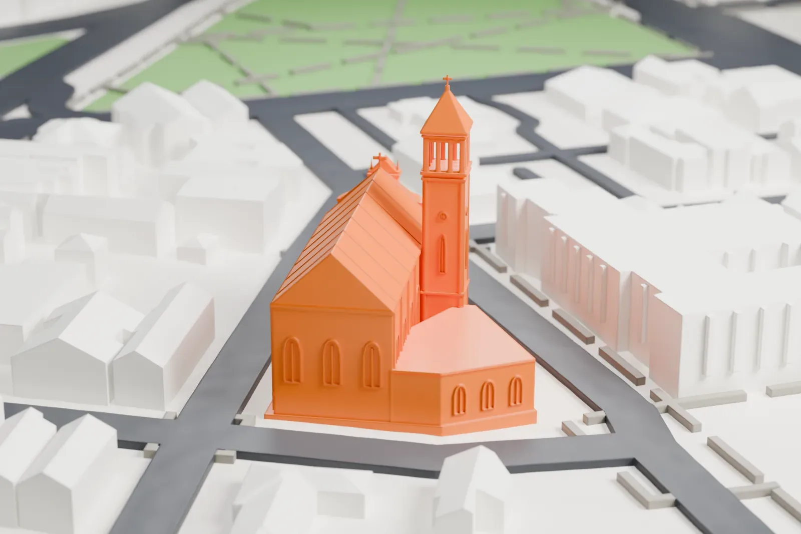 A white 3D print of St. Columba's Church, a church with a tall bell tower and a long steep roof, among city streets and low buildings.