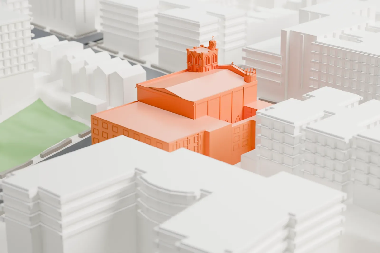 A white 3D print of St. Elizabeth Church, a stone church with a turreted corner tower and a taller wing, among neighboring buildings and streets.