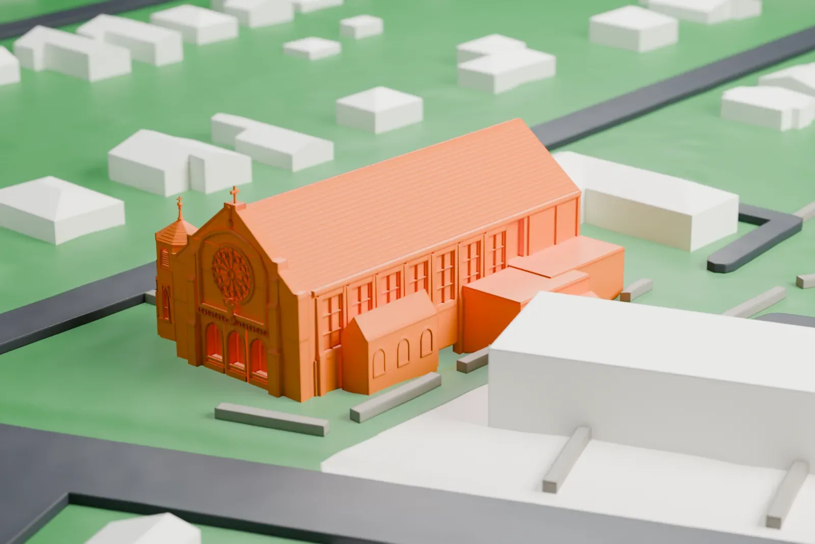 A white 3D print of St. Francis of Assisi Cathedral, a long church with a steep roof, a rose window and a corner tower, on a lawn beside streets and low buildings.