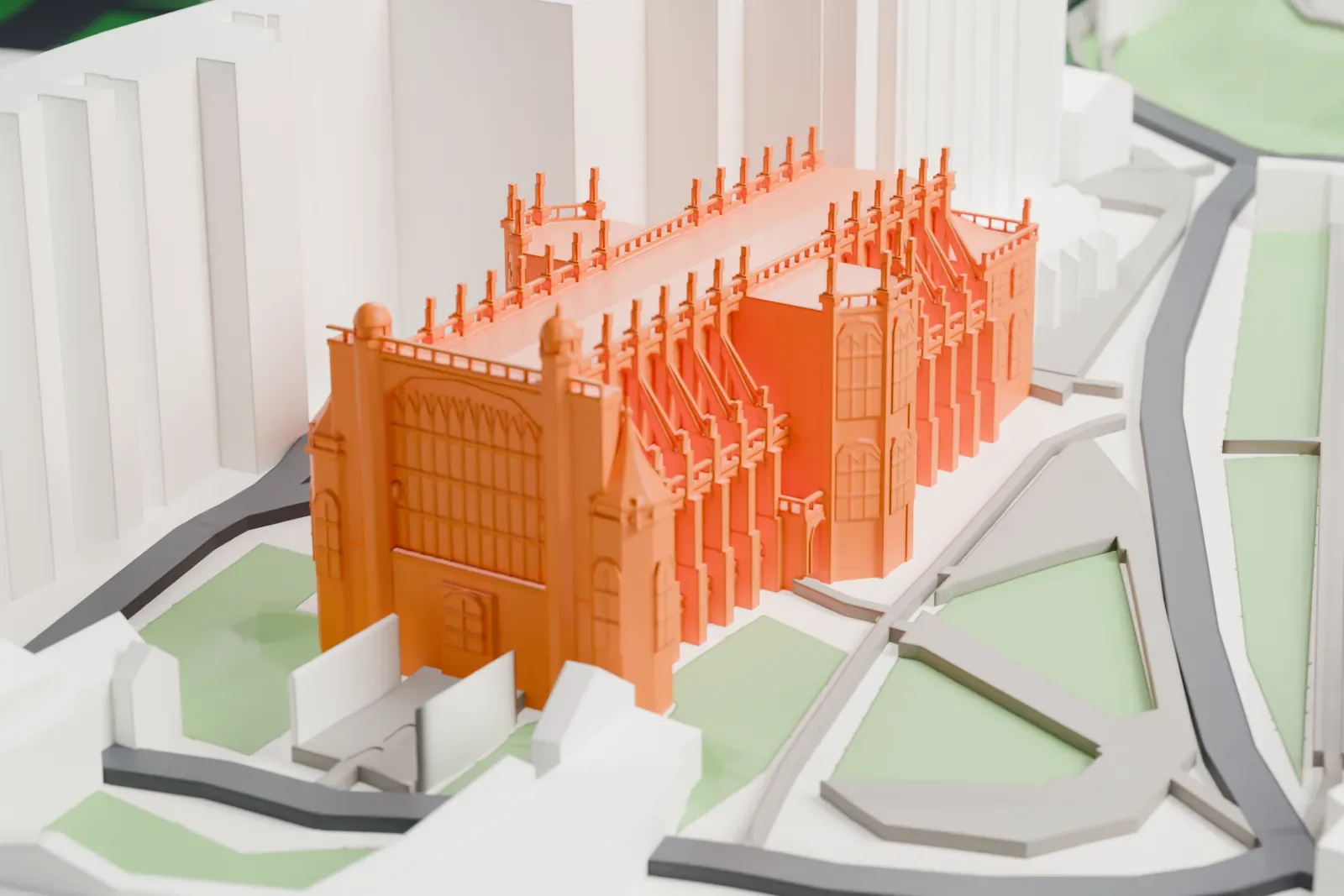 A white 3D print of St George's Chapel, a Perpendicular Gothic chapel with pinnacles along its roof, among the walls and buildings of Windsor Castle.