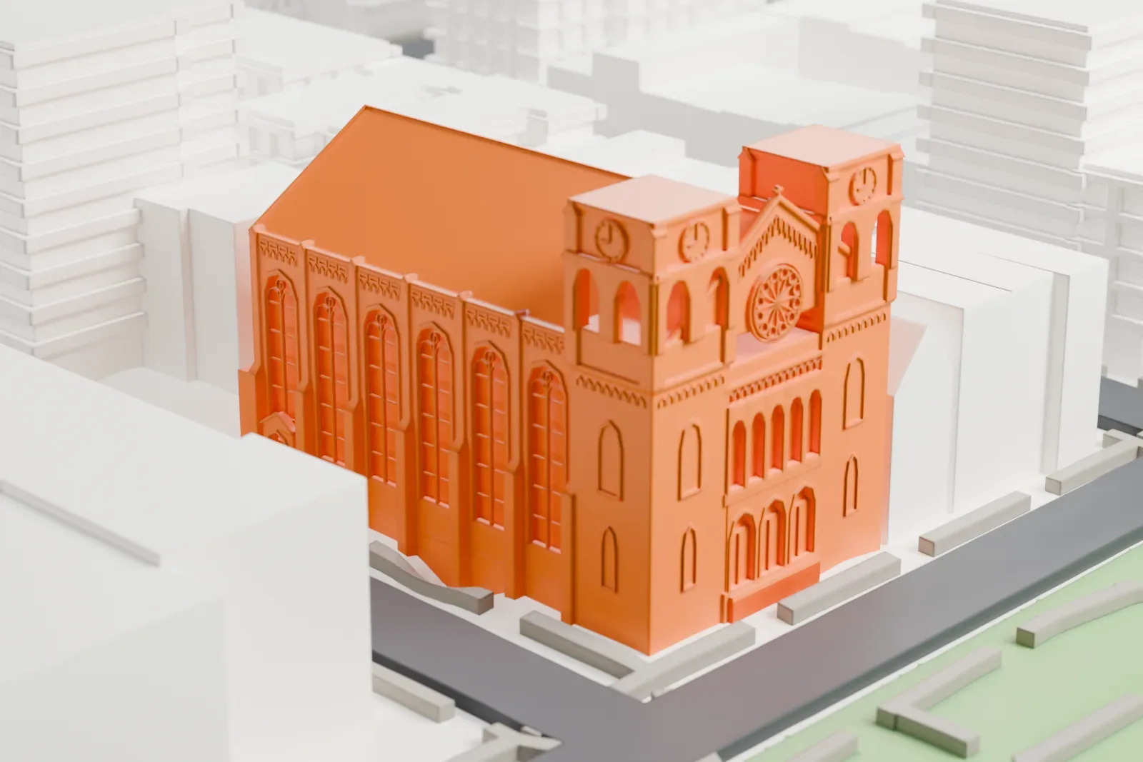 A white 3D print of St. George's Episcopal Church, a long church with two square towers and a round window, beside a green square and surrounded by mid-rise buildings.