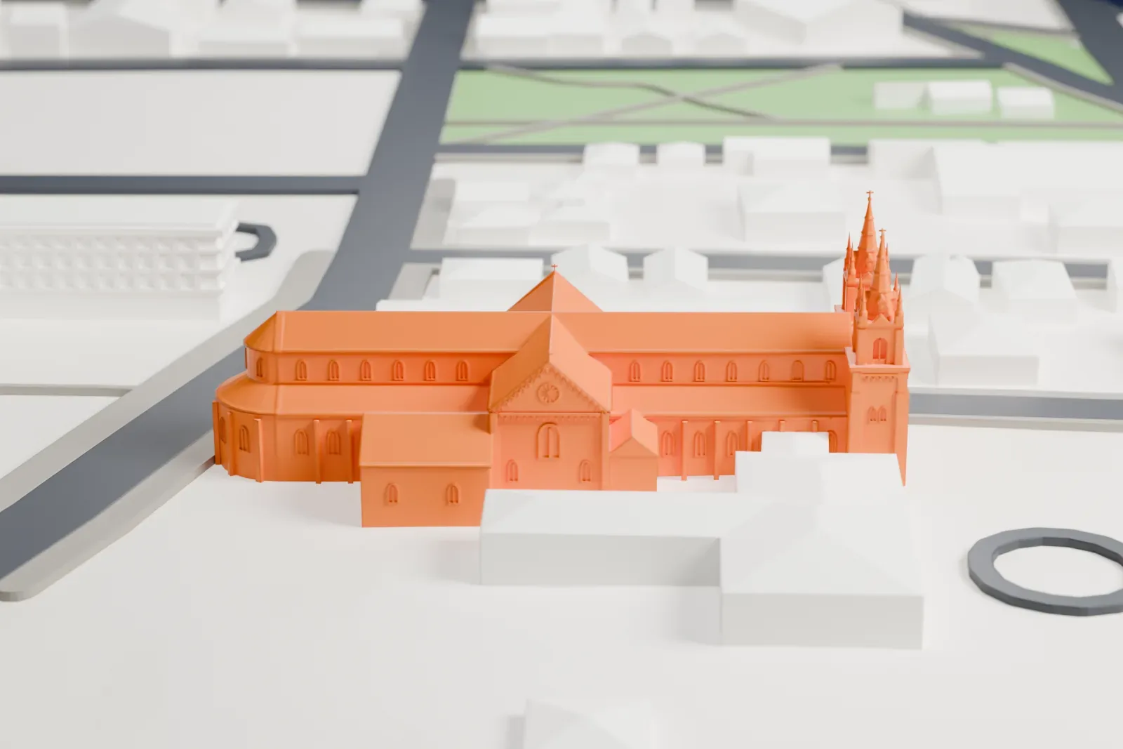A white 3D print of St. Hyacinth's Cathedral with the surrounding streets and buildings.