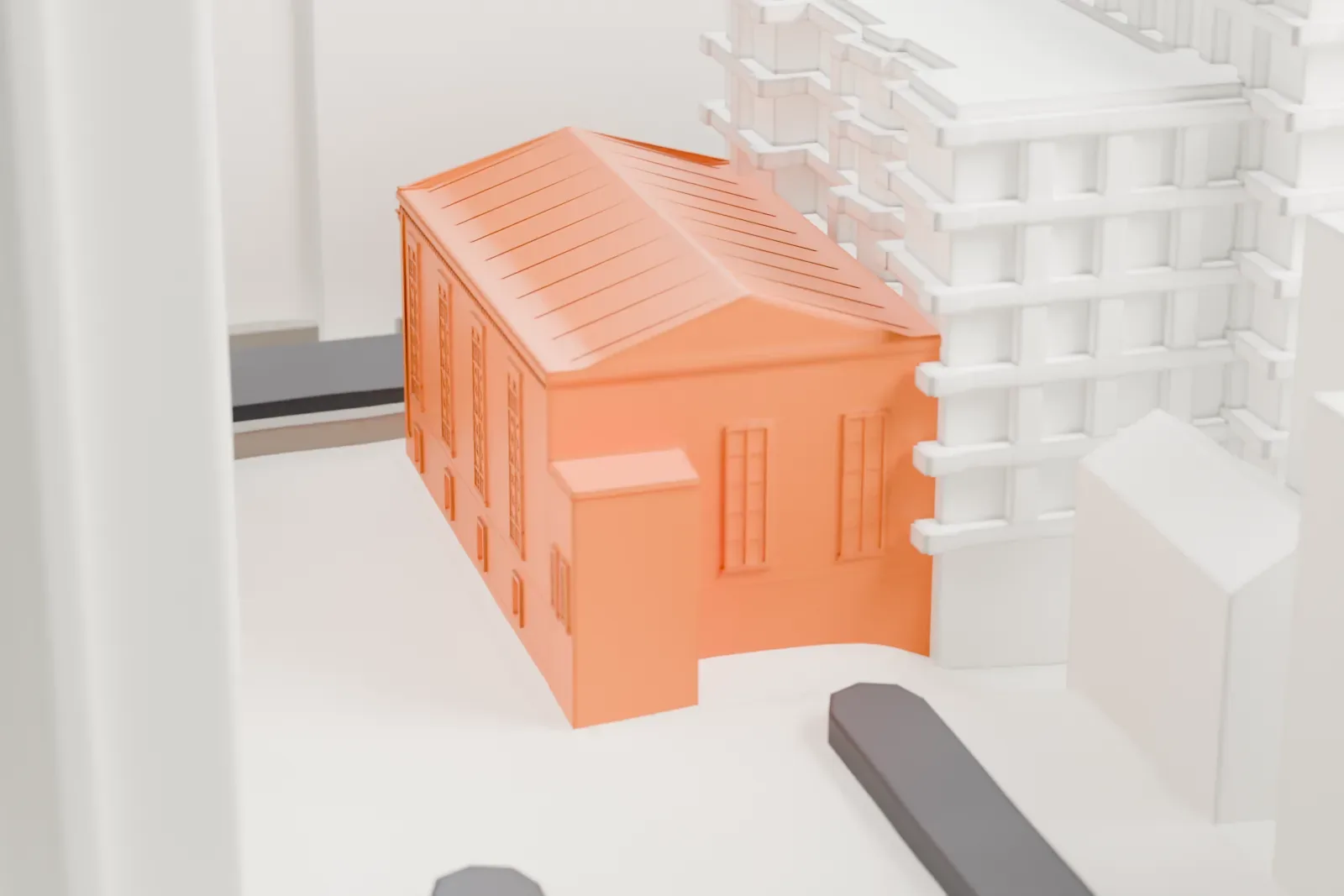 A white 3D print of St. Illuminator's Armenian Apostolic Cathedral, a small gabled building tucked among much taller buildings.