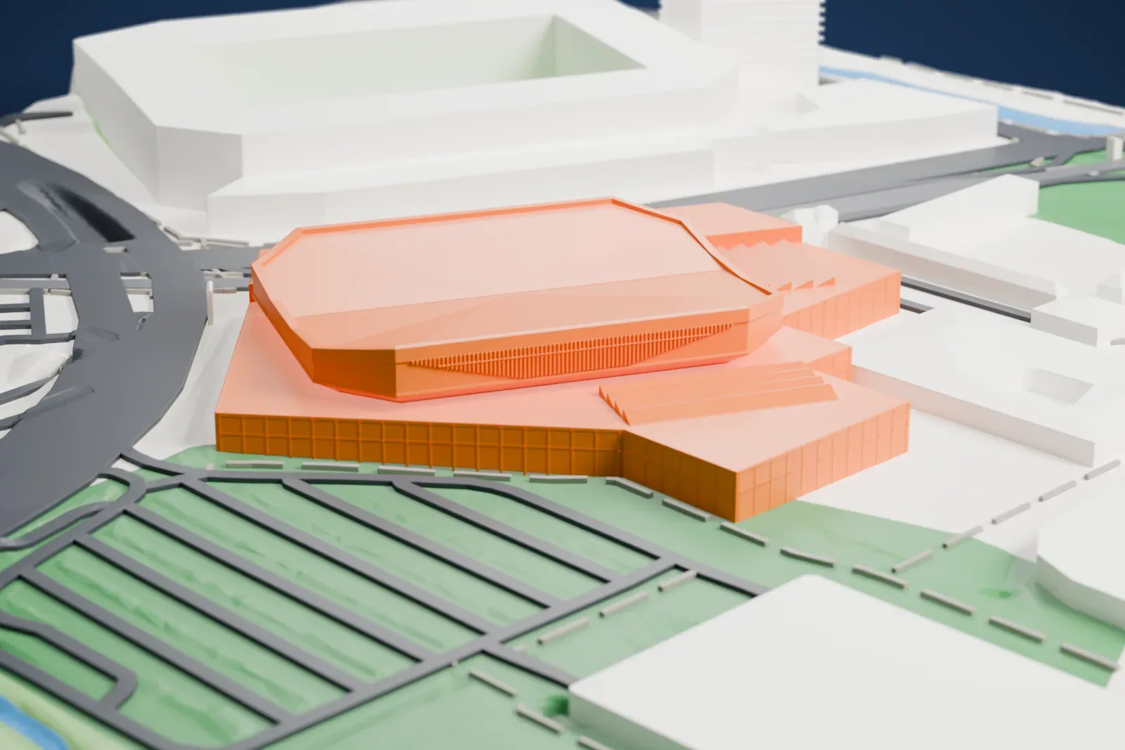 A white 3D print of the St. Jakobshalle, an octagonal hall with a sagging roof and a deep ring beam, a long flat canopy along one side and low halls beside it, among the streets and buildings around it.