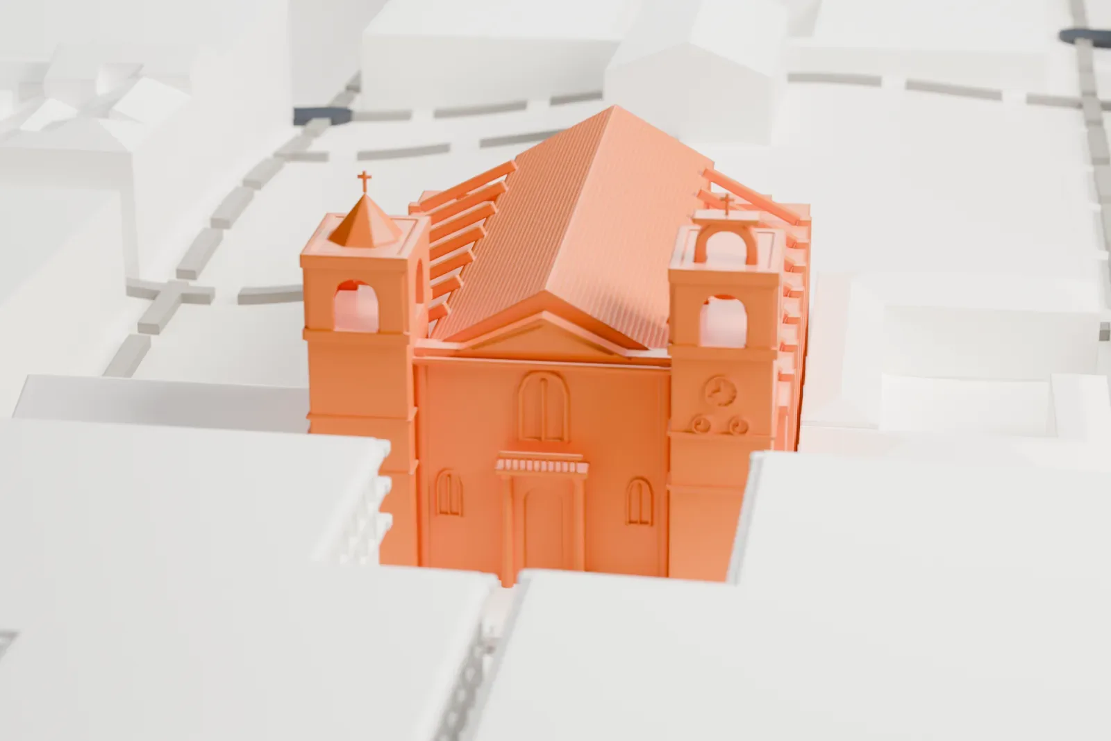 A white 3D print of St John's Co-Cathedral, a long church with a ridged roof and two bell towers at the front, packed in among plain, blocky buildings.